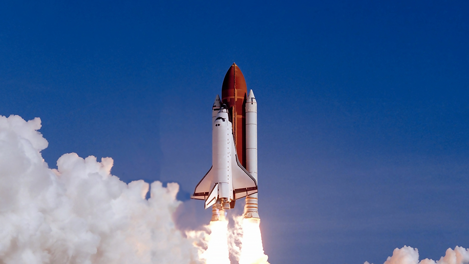 Space shuttle taking off